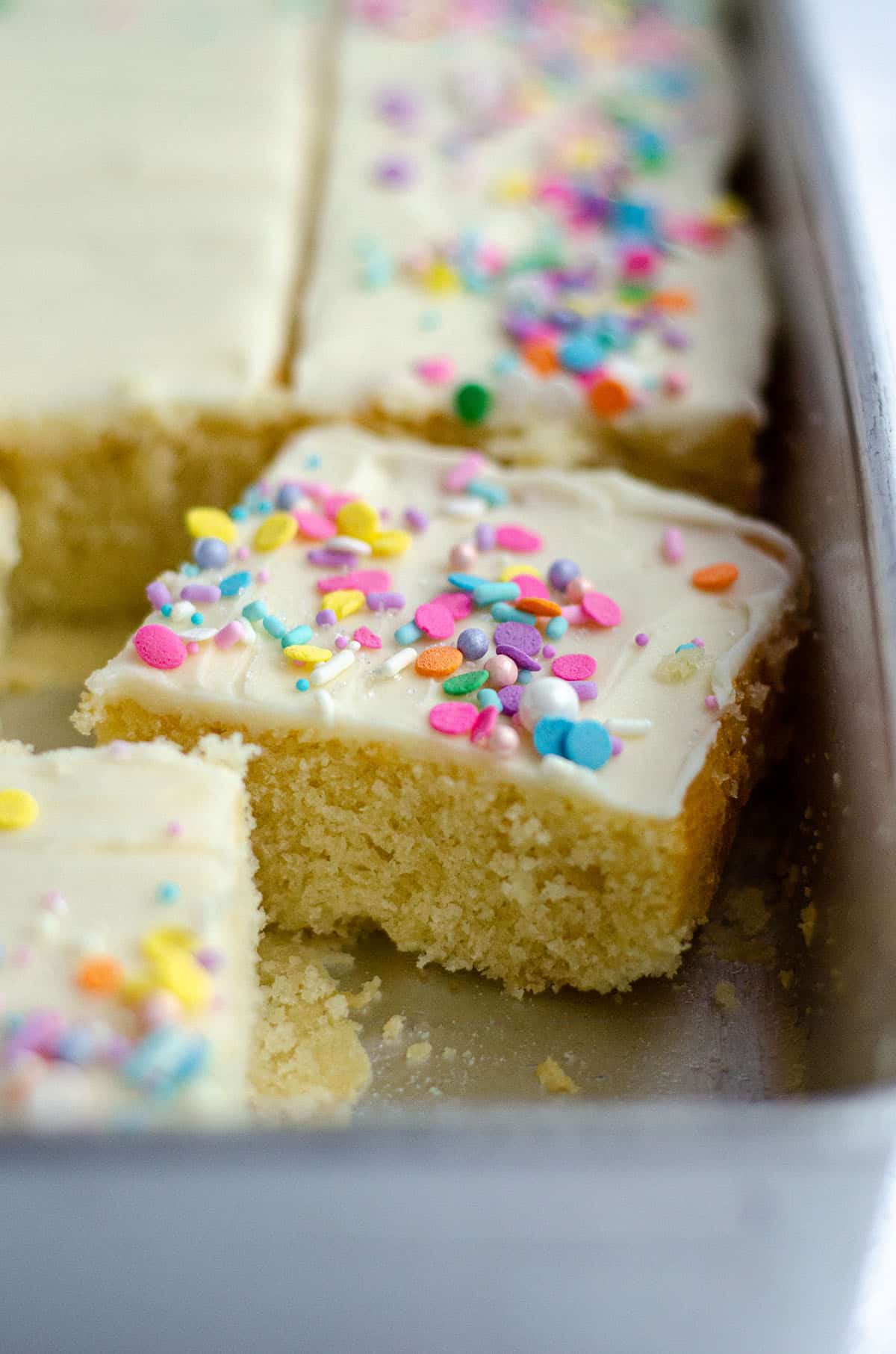 Simple White Sheet Cake: A perfectly moist and simple white cake that pairs with any frosting you prefer.