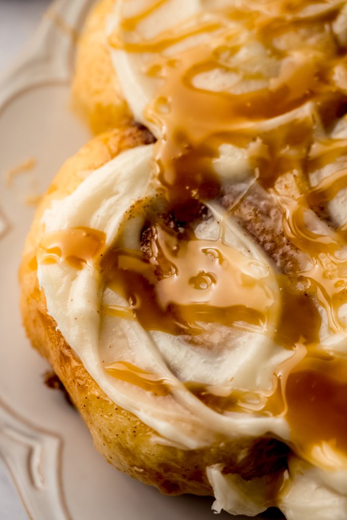 A photo of a plate of caramel cinnamon rolls.