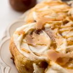 A photo of a plate of caramel cinnamon rolls.