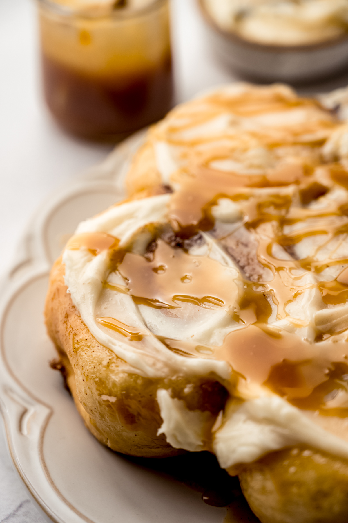 A photo of a plate of caramel cinnamon rolls.