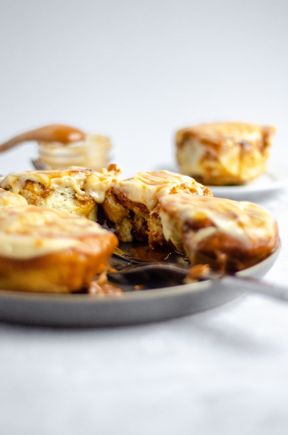 caramel rolls on a serving plate