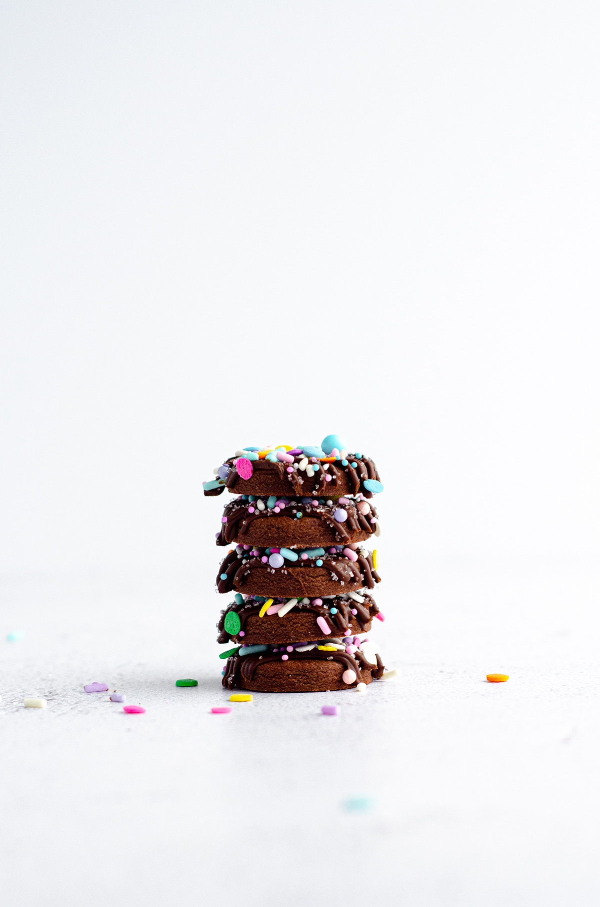 stack of decorated chocolate cut-out sugar cookies