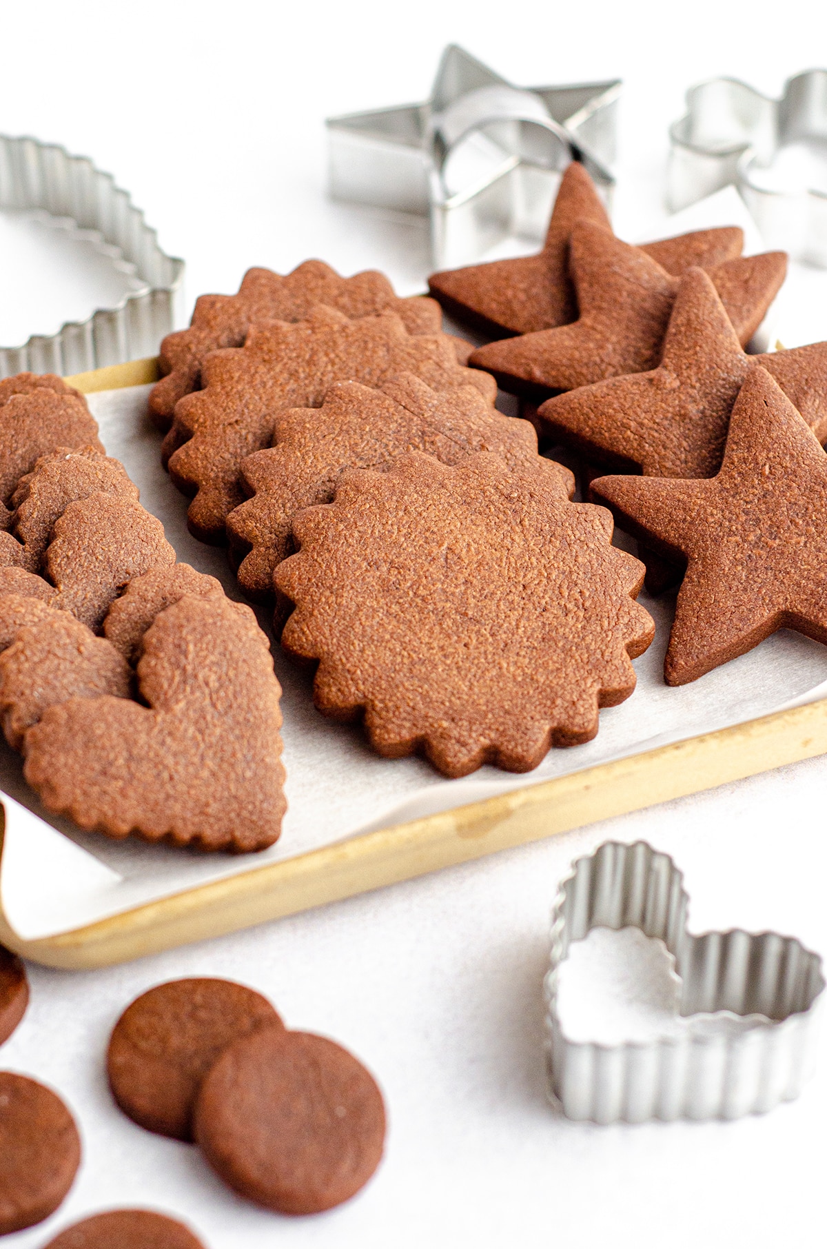 undecorated chocolate cut-out sugar cookies on a plate 