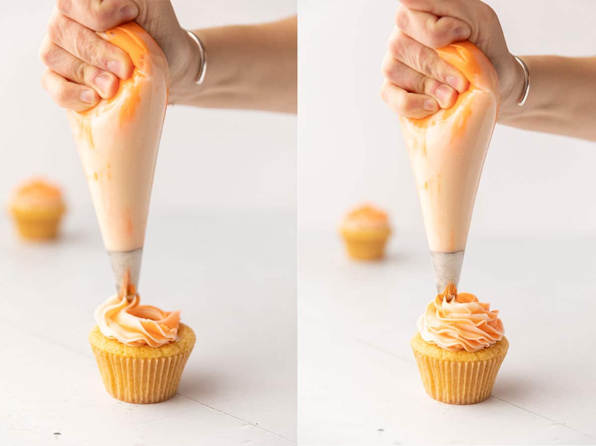 piping orange creamsicle frosting onto an orange creamsicle cupcake