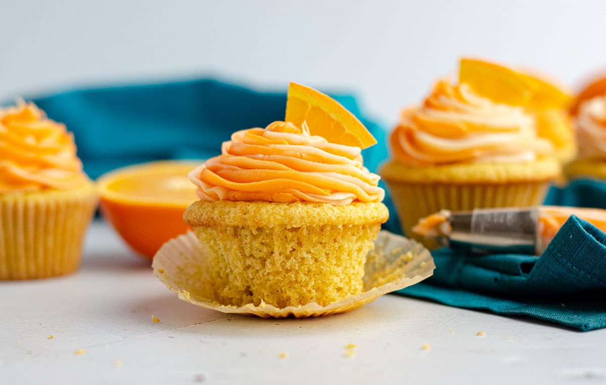 orange creamsicle cupcake sitting in its wrapper
