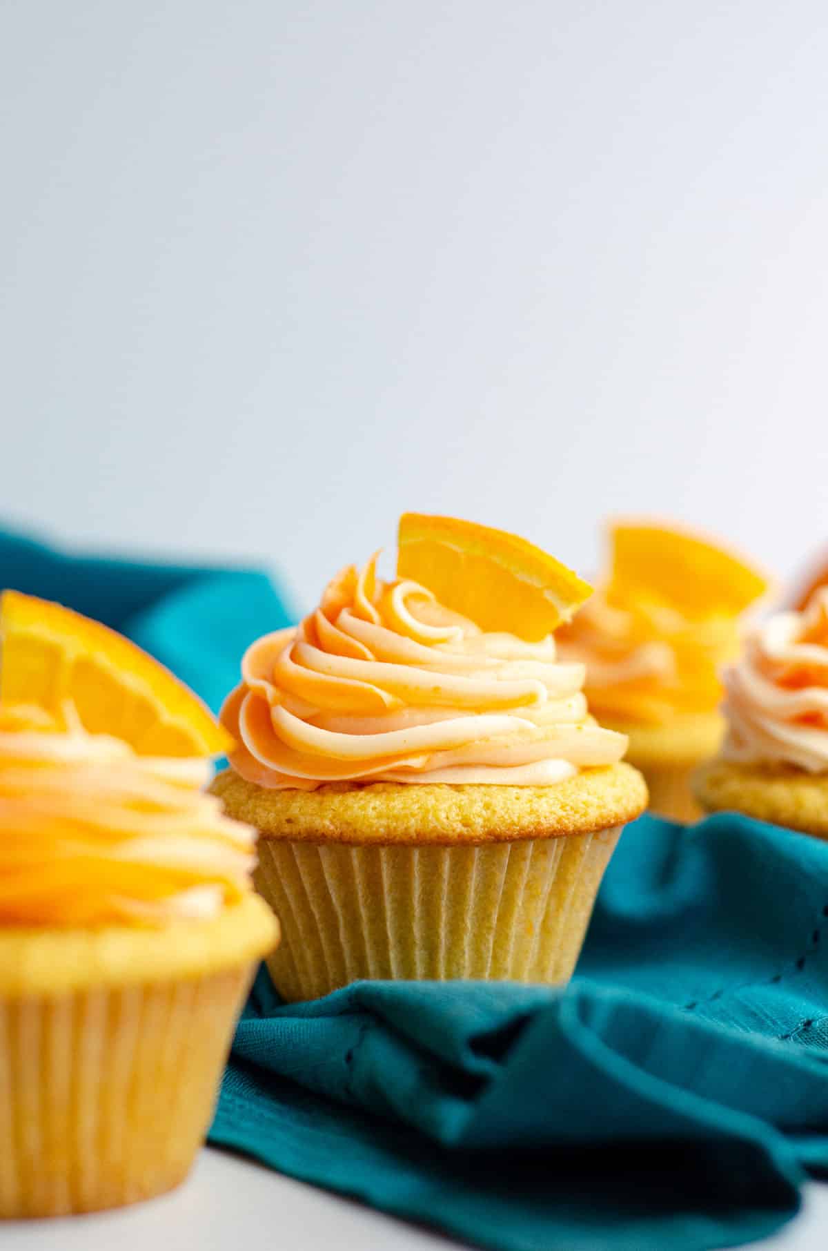 Orange Creamsicle Cupcakes: Simple orange cupcakes topped with swirls of orange and cream cheese frostings.