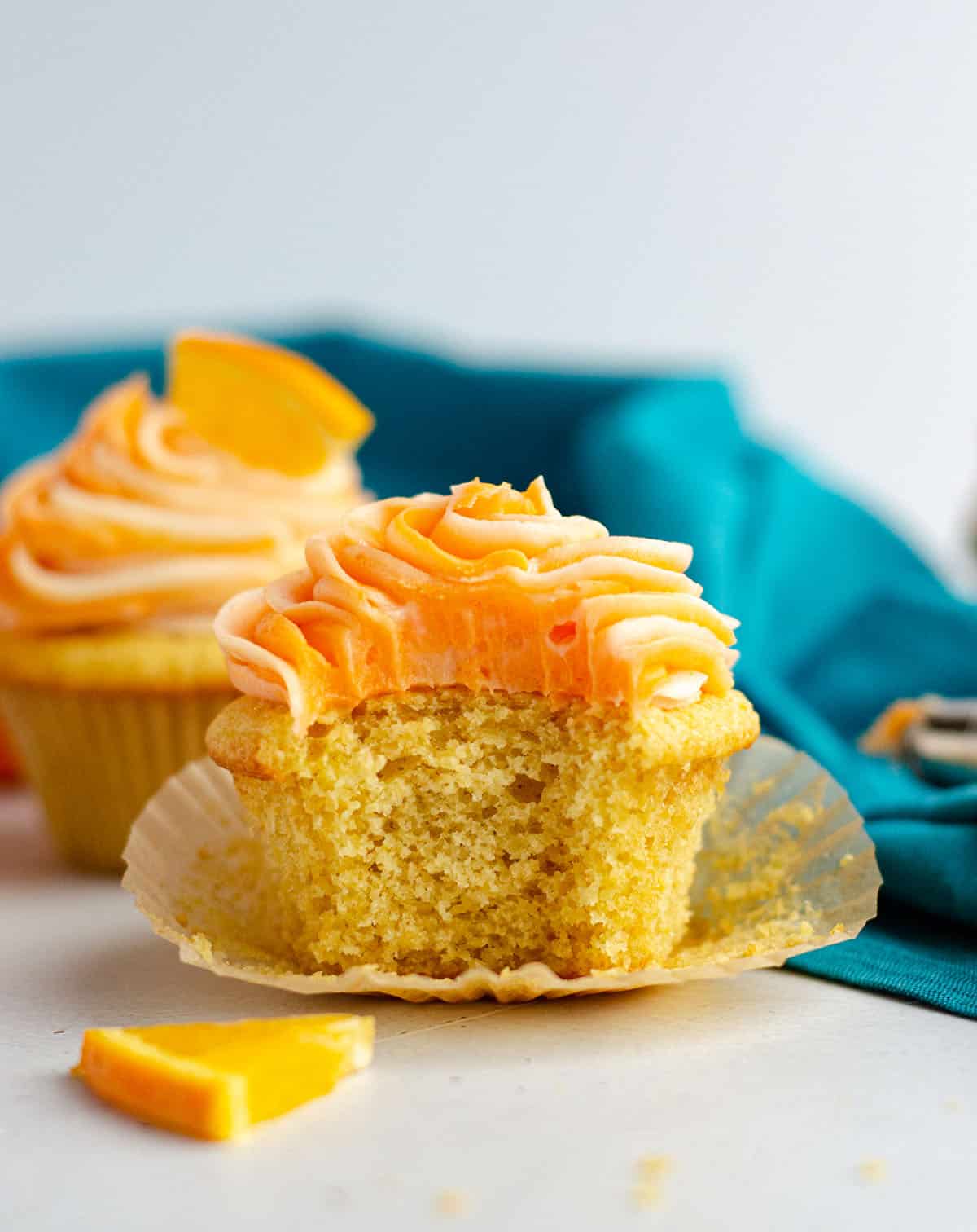 orange creamsicle cupcake with a bite taken out of it