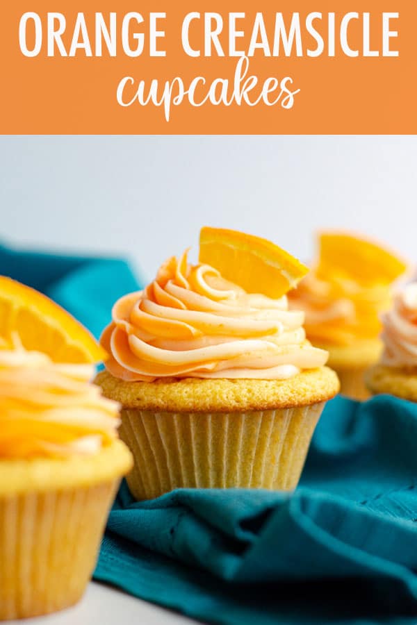 Simple orange cupcakes topped with swirls of orange and cream cheese frostings. via @frshaprilflours