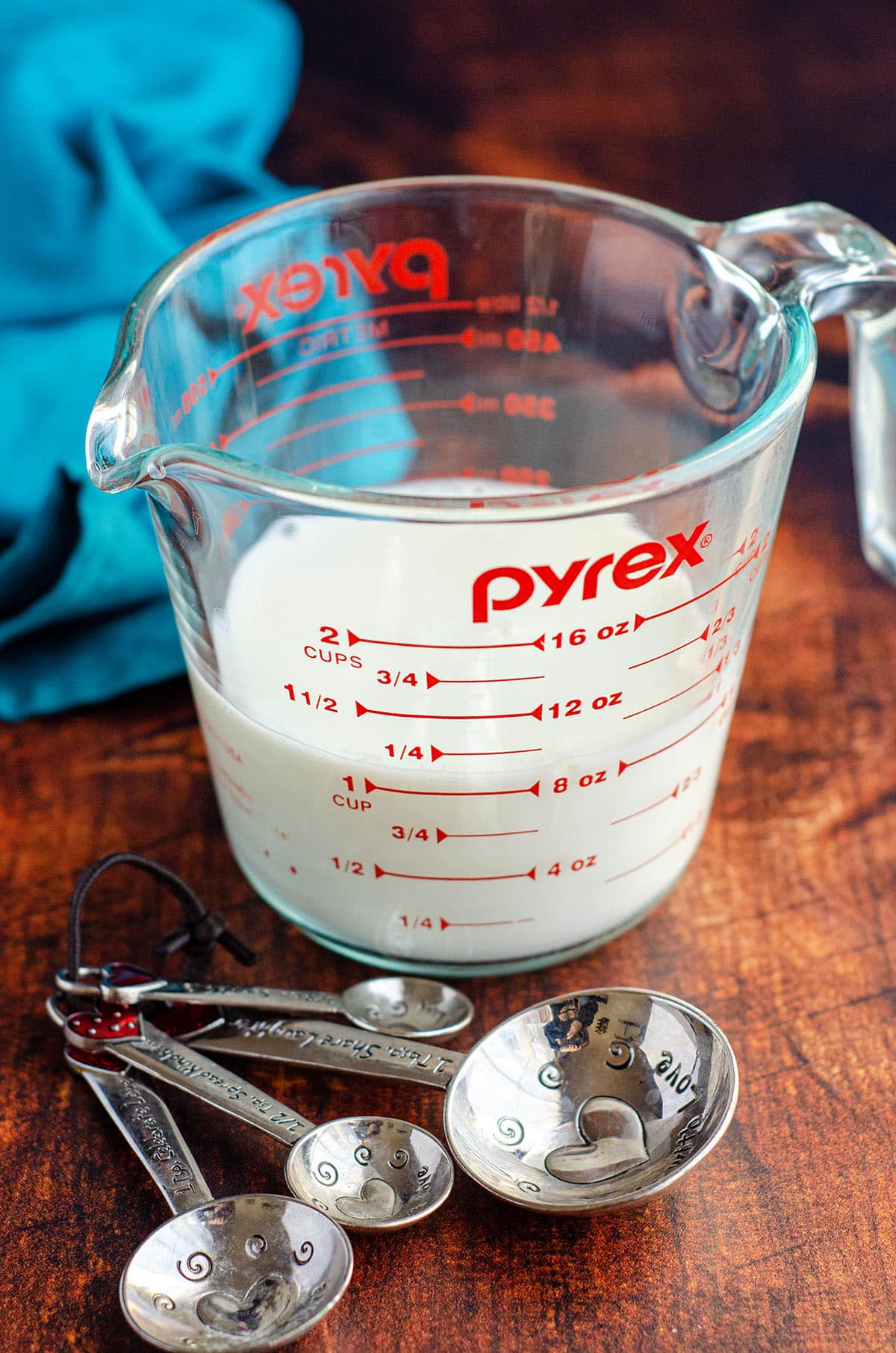 homemade buttermilk in a glass measuring cup