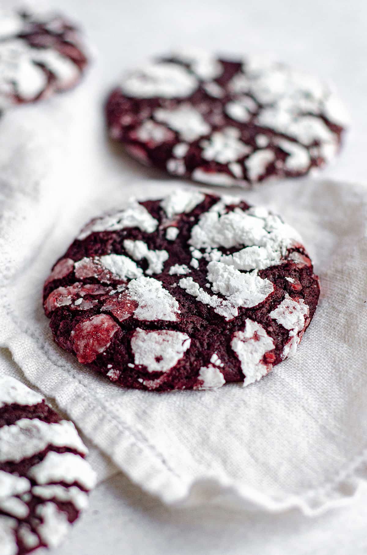 red velvet crinkle cookie on a white kitchen linen