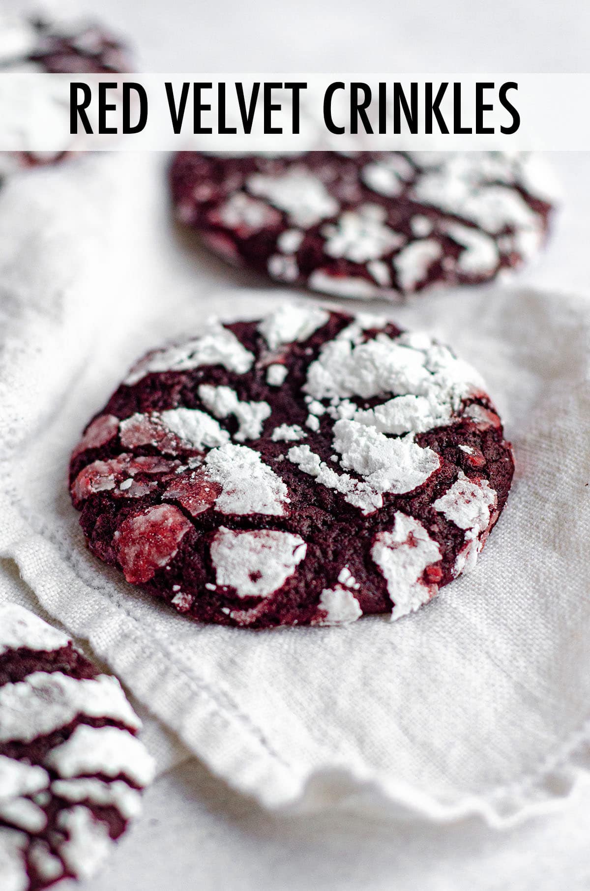 Soft and chewy red velvet cookies covered in crackled powdered sugar. No box mix required– they’re made completely from scratch! via @frshaprilflours