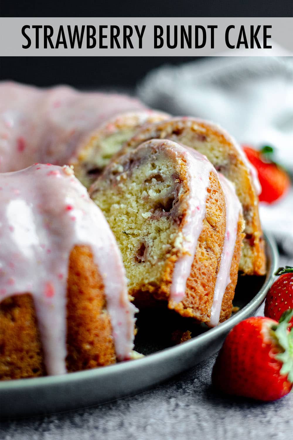 Homemade strawberry bundt cake made from scratch with fresh strawberries and topped with strawberry white chocolate ganache. via @frshaprilflours