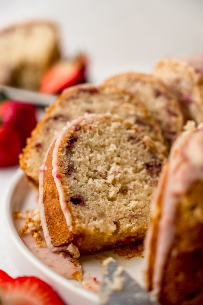 Slices of strawberry Bundt cake on a plate.