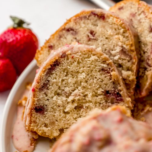 Slices of strawberry Bundt cake on a plate.