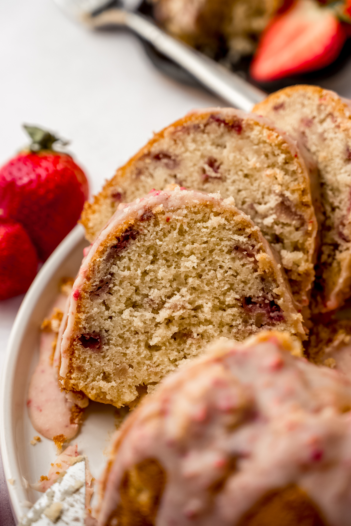 Slices of strawberry Bundt cake on a plate.