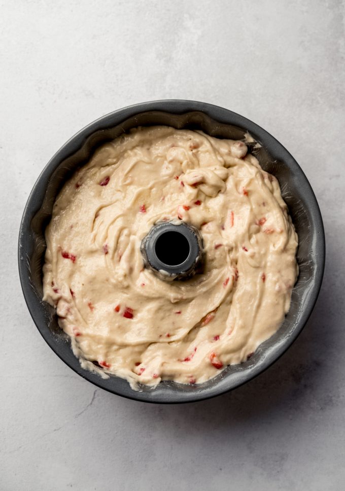 Aerial photo of strawberry Bundt cake batter in a pan.