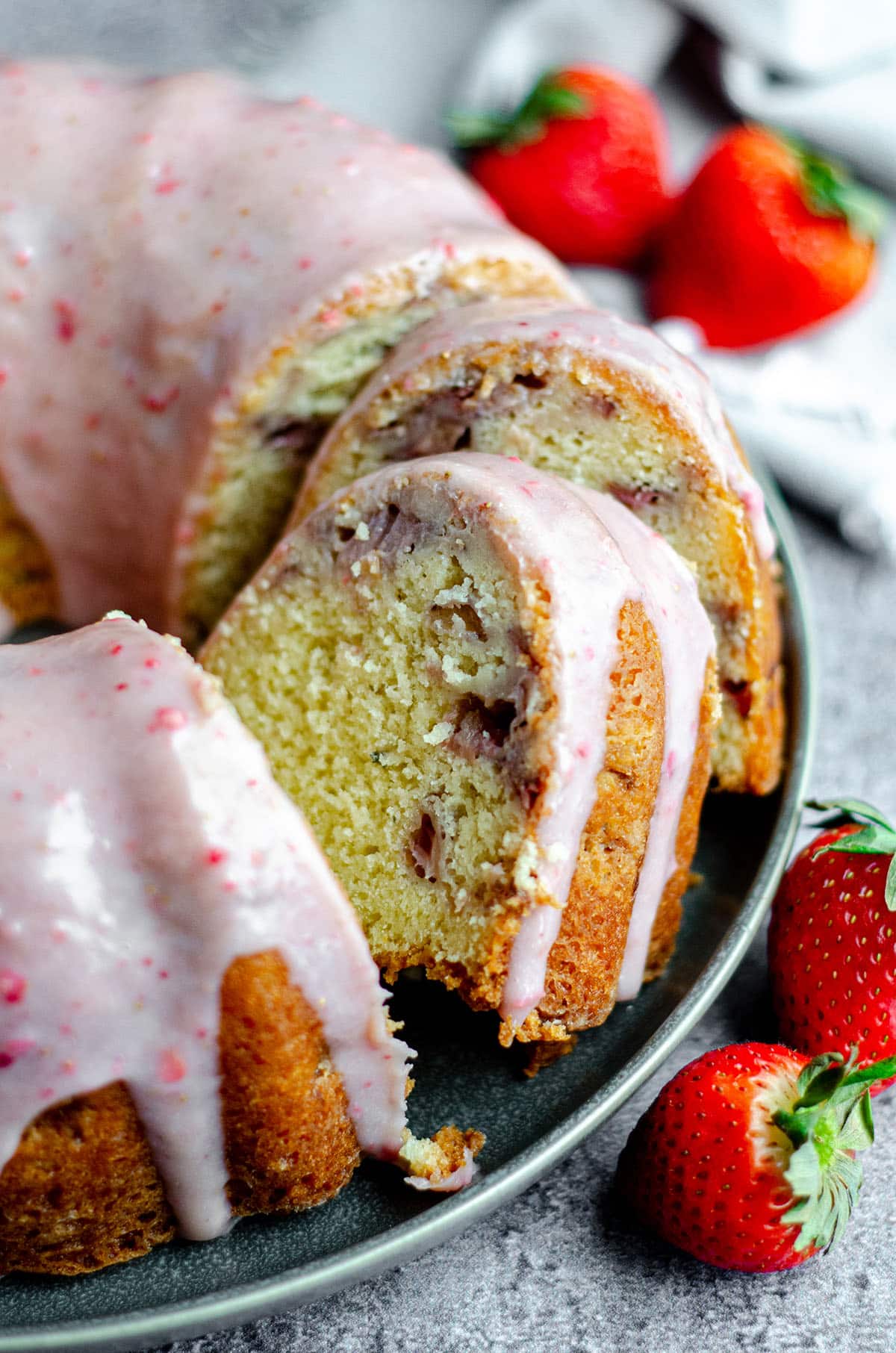 sliced strawberry bundt cake on a plate