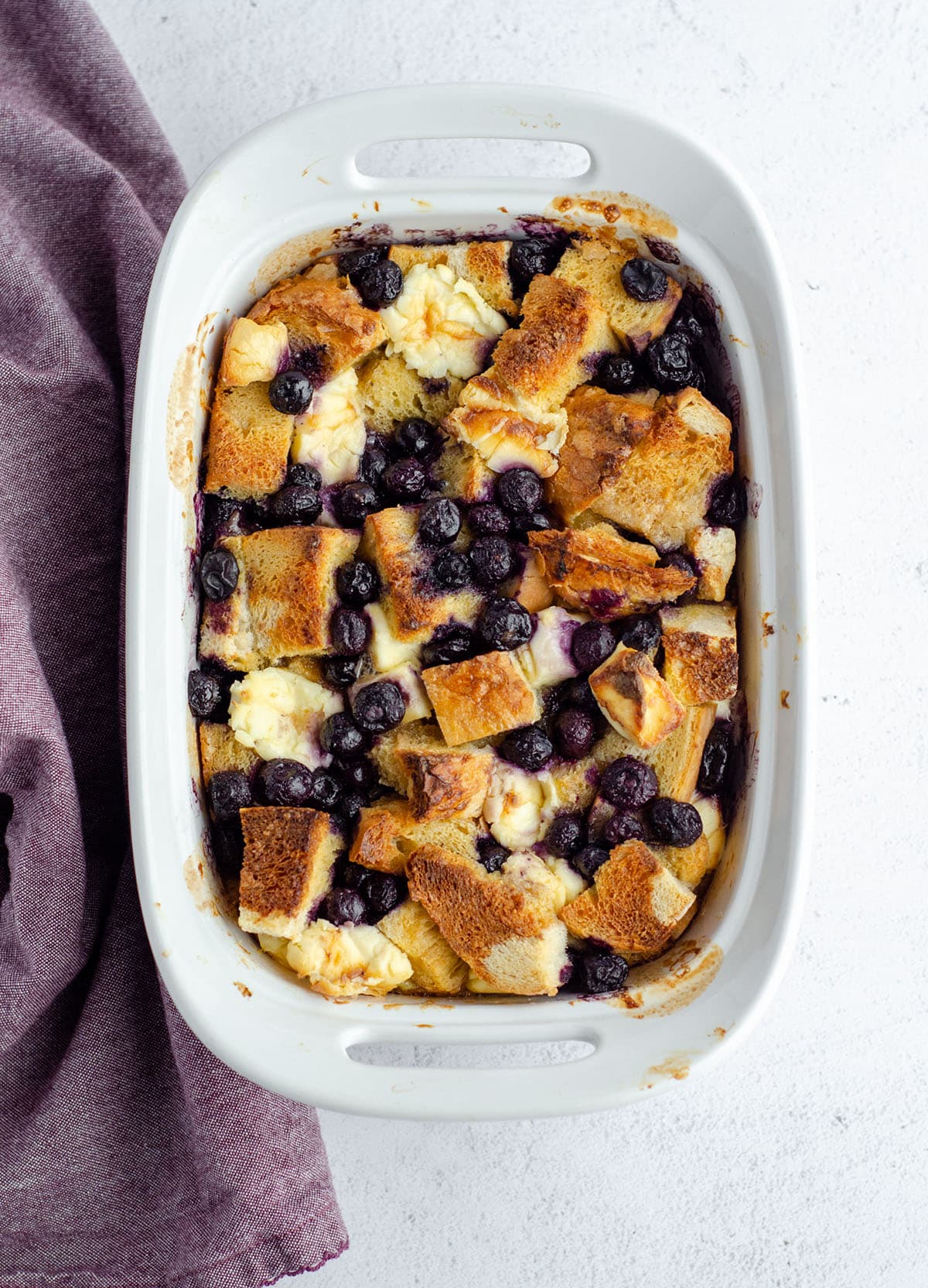 aerial photo of baked blueberry french toast in a casserole dish
