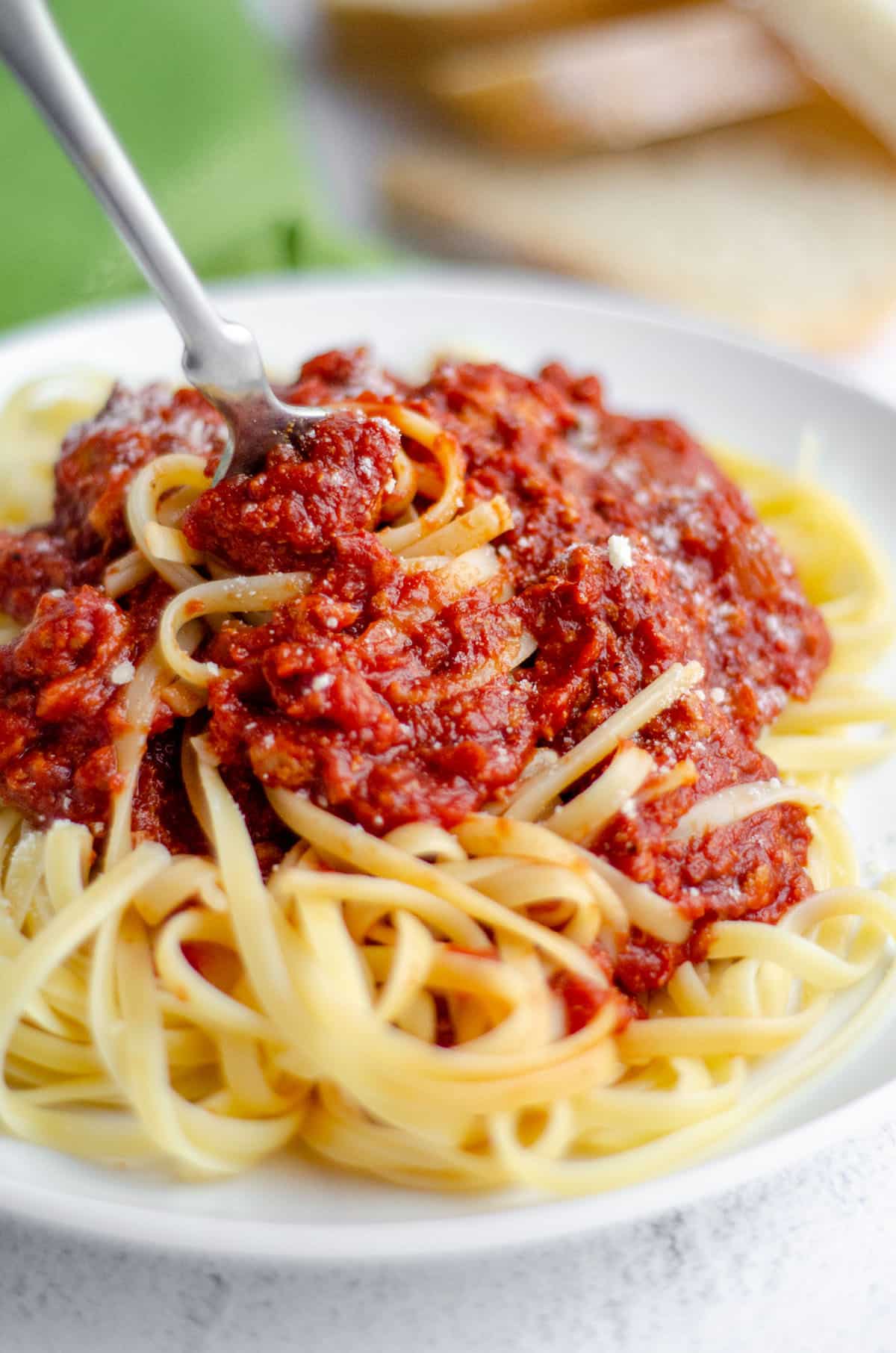 Homemade Meat Sauce: An easy homemade pasta sauce made with five simple ingredients. This recipe has been in my family for over a century and is a go-to for pasta dishes and lasagna or over vegetables or eggs.