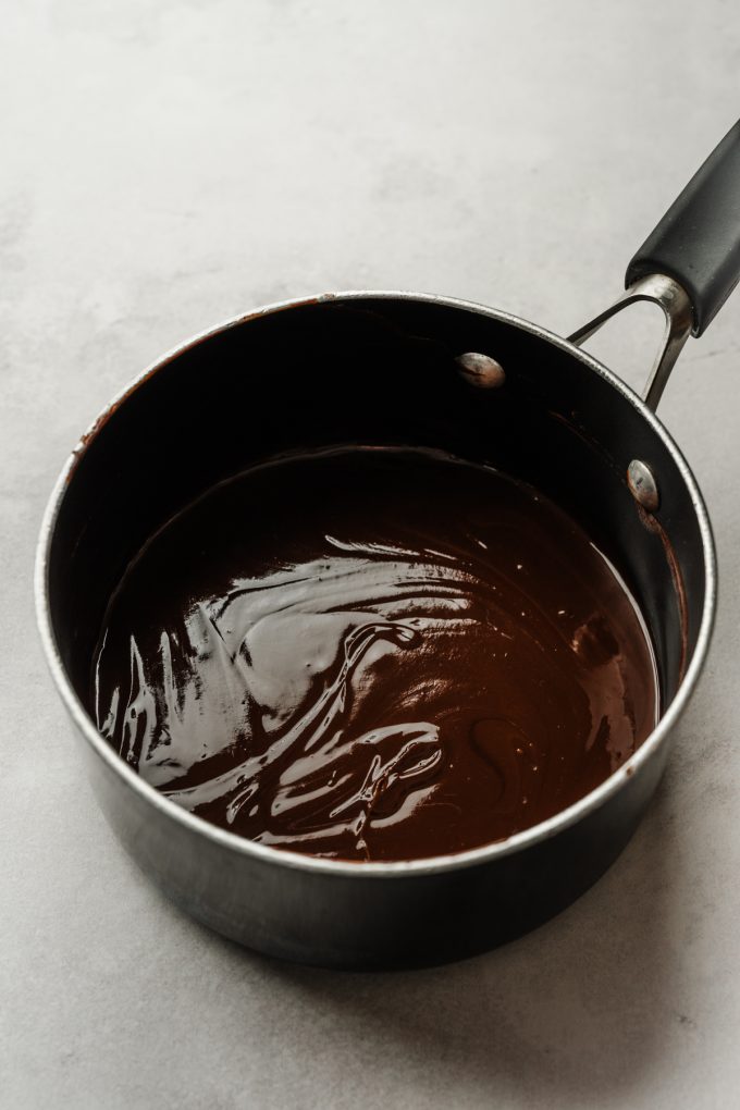 The base of brownie batter in a saucepan.