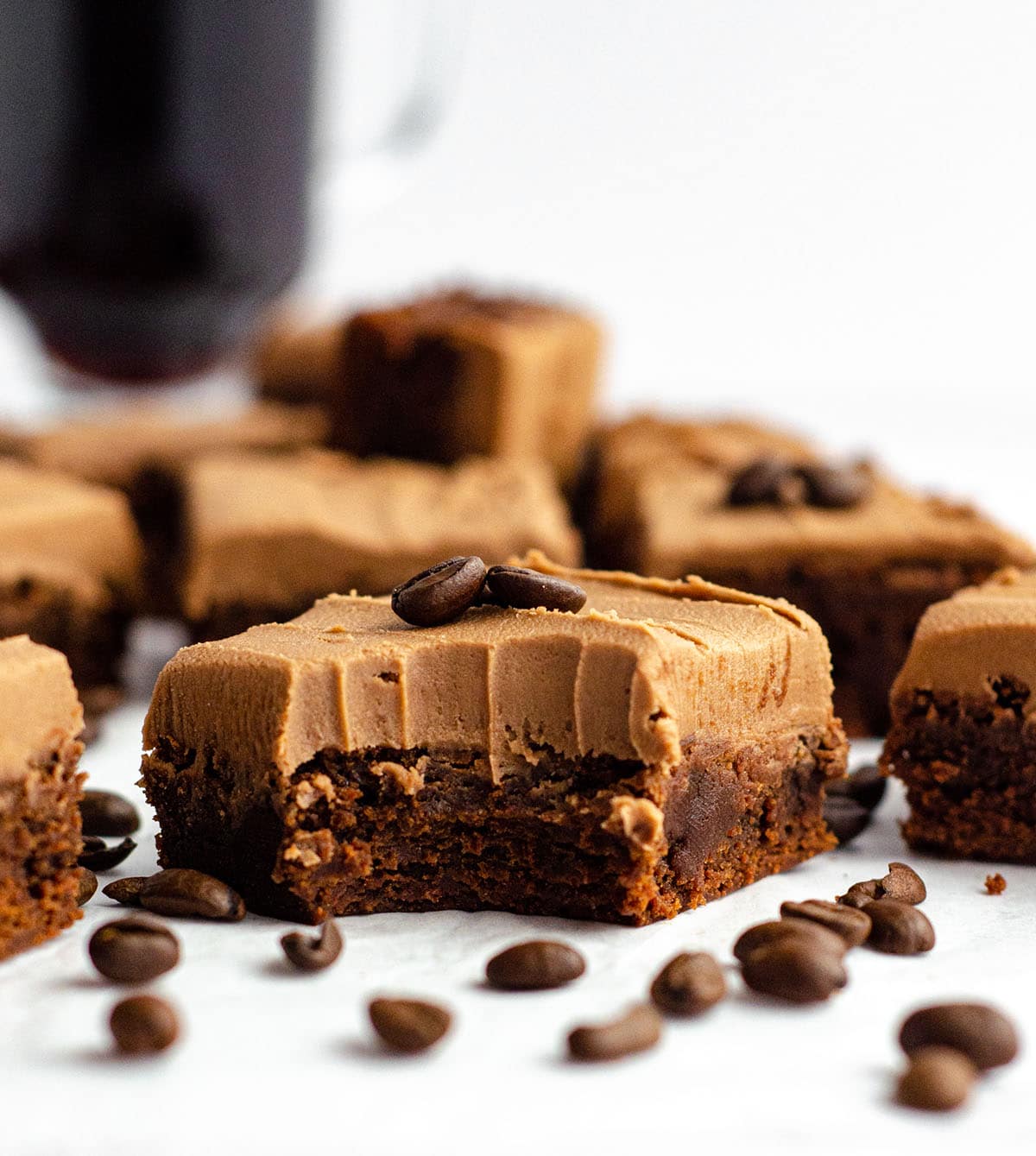 coffee brownie with mocha frosting with a bite taken out of it