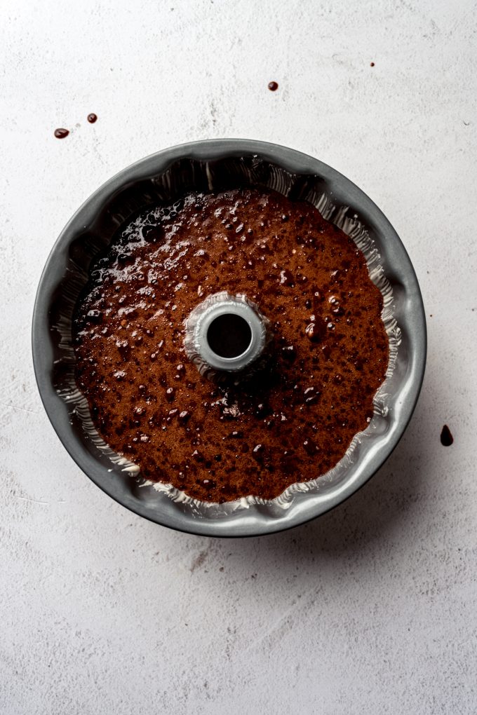 Aerial photo of chocolate Bundt cake batter in a Bundt pan.