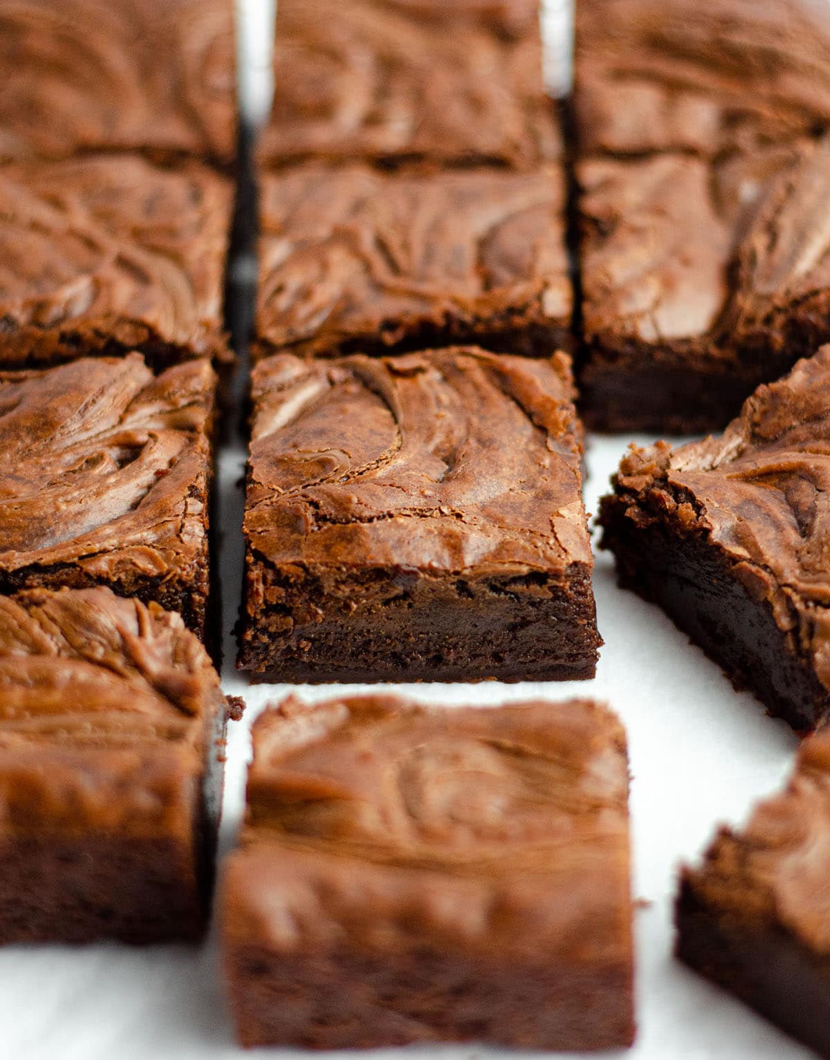 fudgy nutella brownies sliced and sitting on a white surface