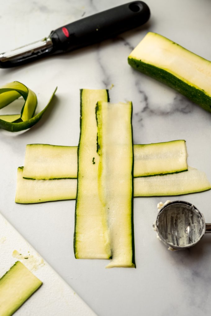 Zucchini layers made into a T shape to make zucchini ravioli.