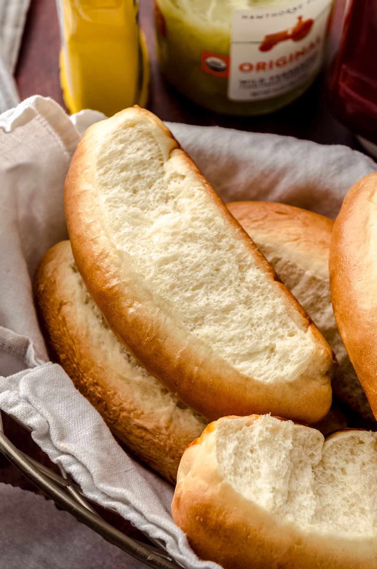 Homemade hot dog buns in a basket.