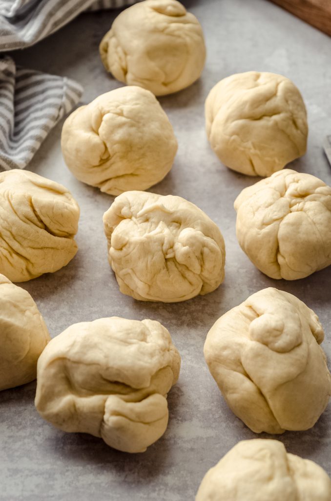 Balls of dough ready to make homemade hot dog buns.