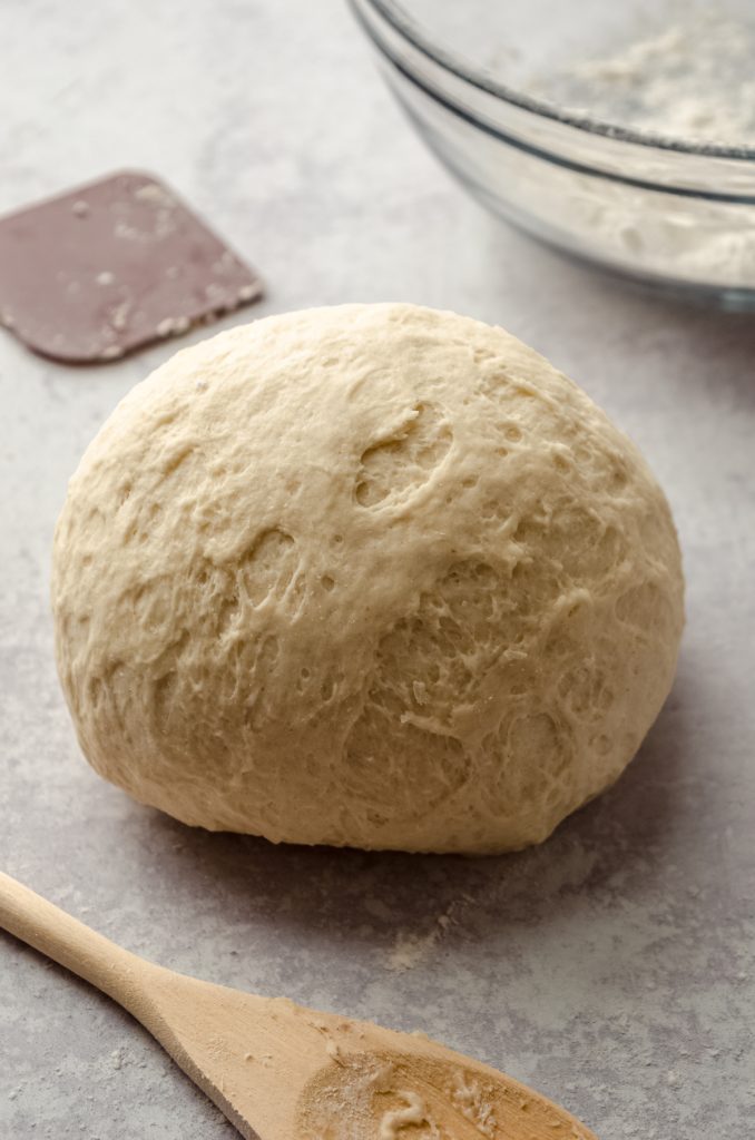 A ball of dough on a surface.
