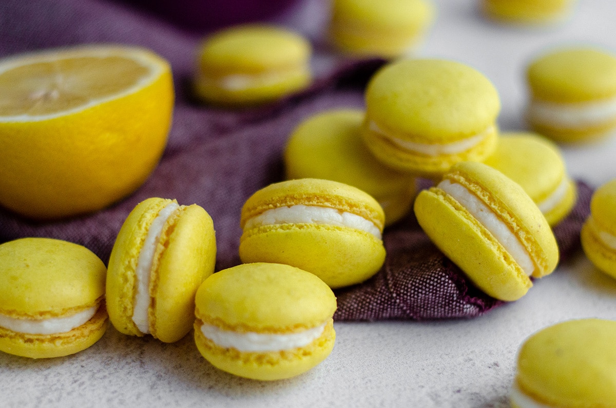 lemon macarons on a purple kitchen towel