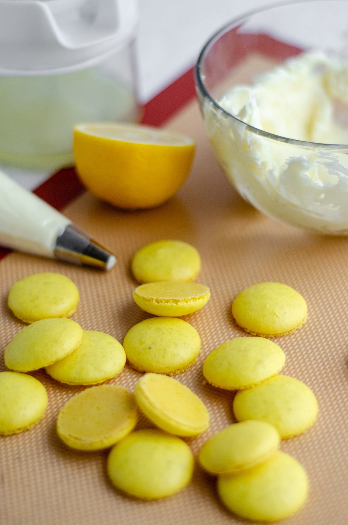 lemon macarons ready to assemble with frosting 