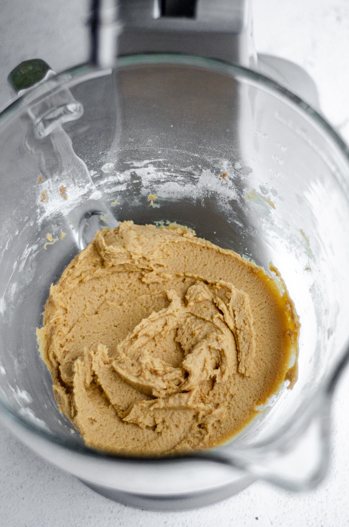 peanut butter cookie dough in a glass mixing bowl