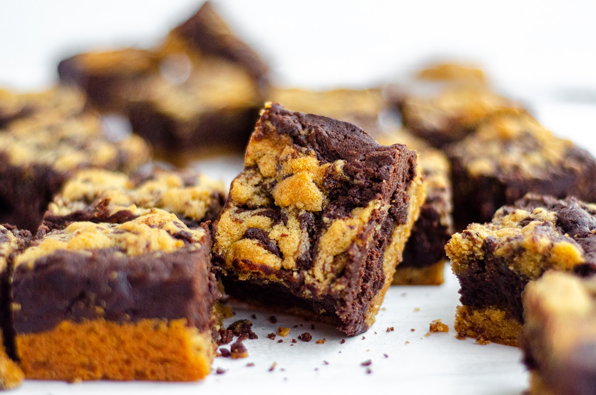 collection of peanut butter cookie brownies on a white surface