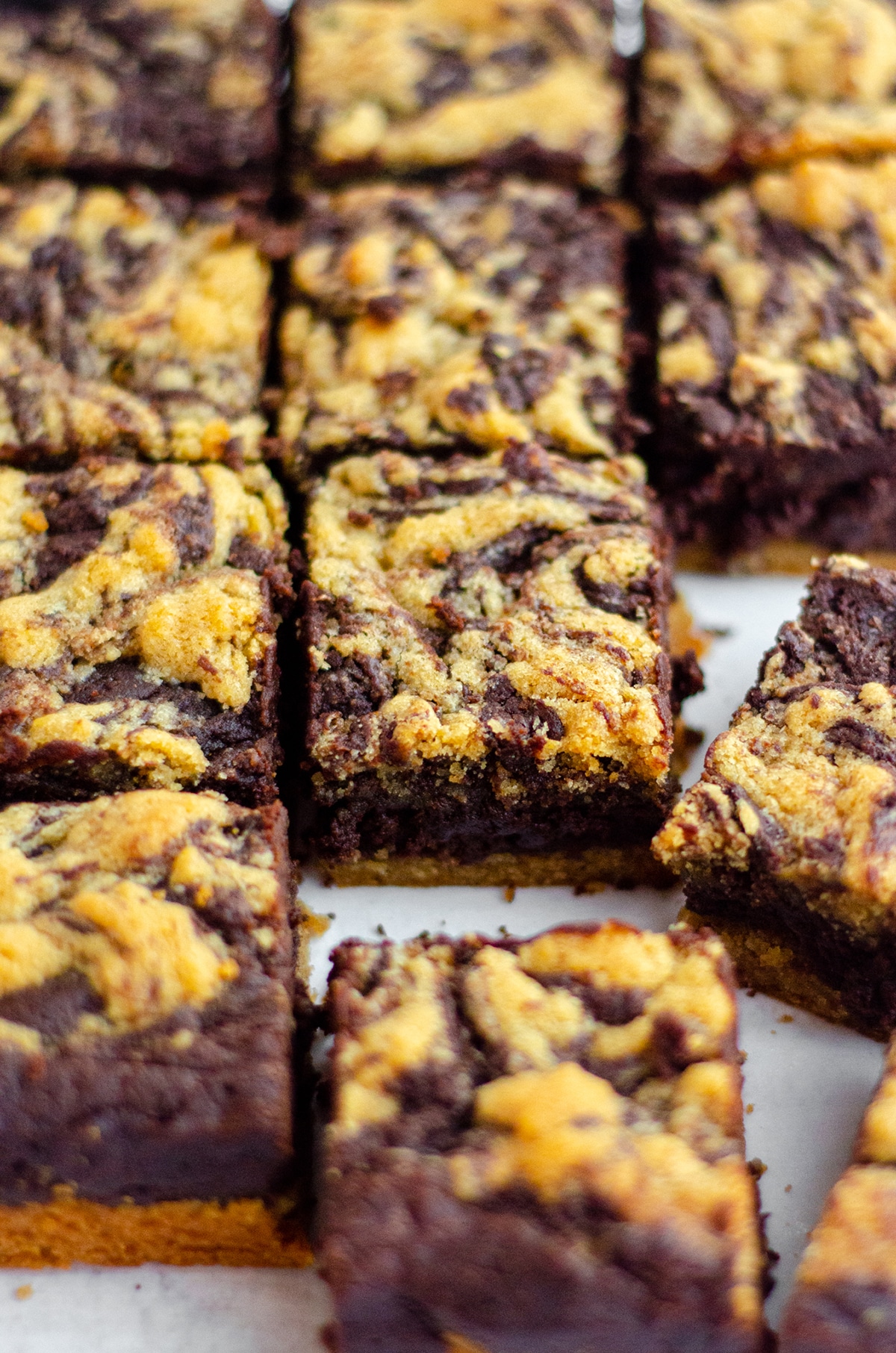 Peanut Butter Cookie Brownies: Soft and chewy brownies sit atop a peanut butter cookie crust and get swirled with peanut butter cookie batter to create peanut butter brownies unlike any other!