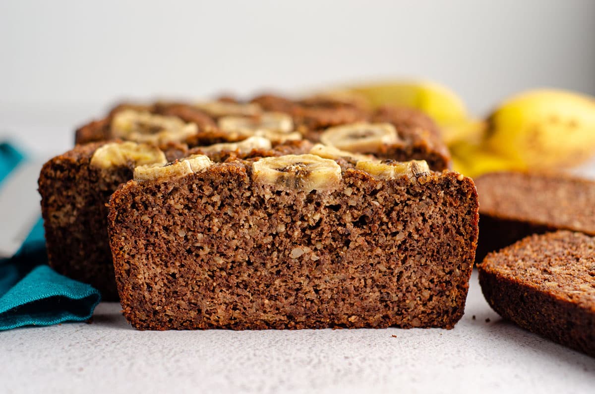 sliced almond flour banana bread sitting on a platter