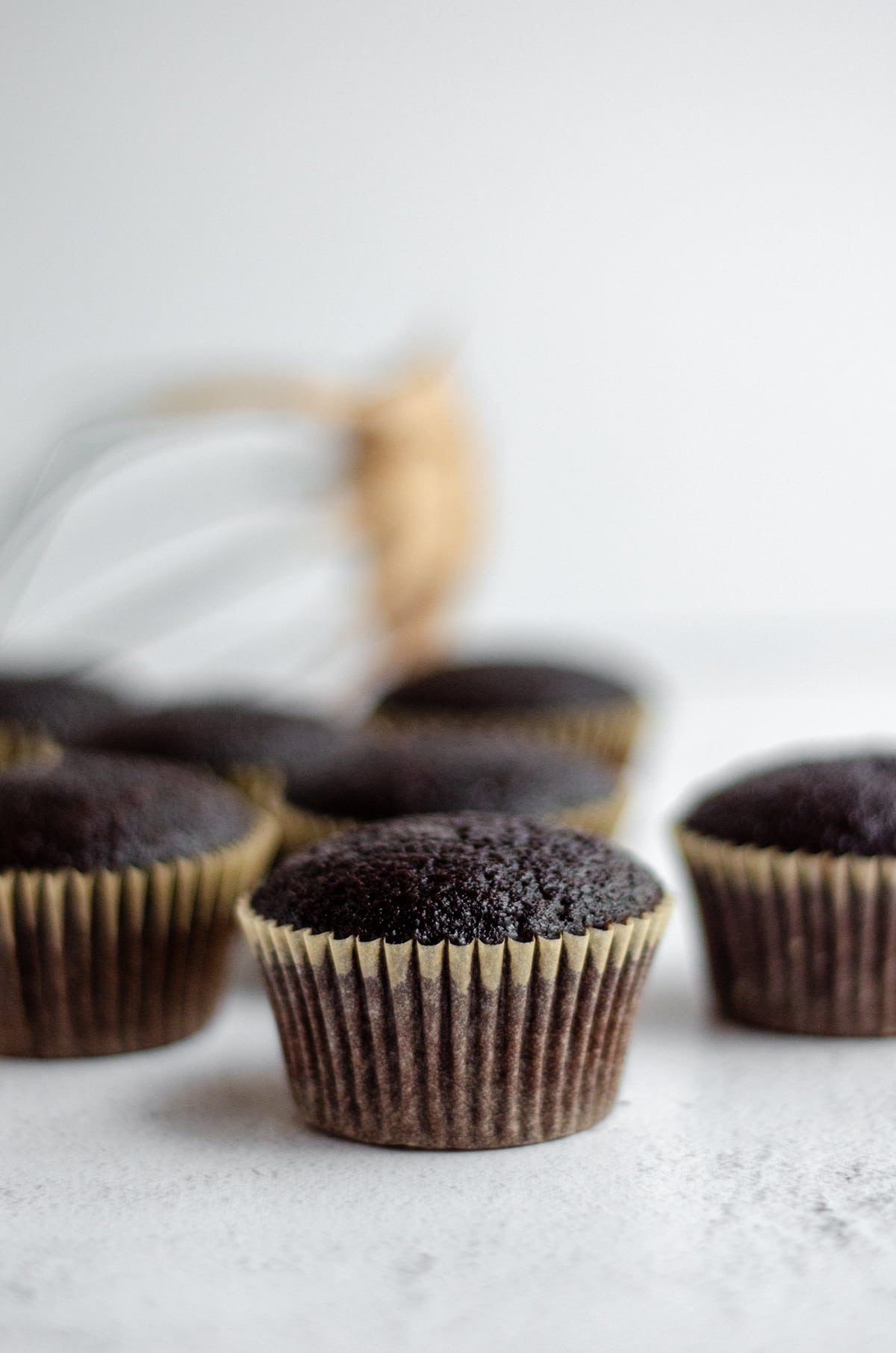 chocolate cupcakes ready to be piped with frosting