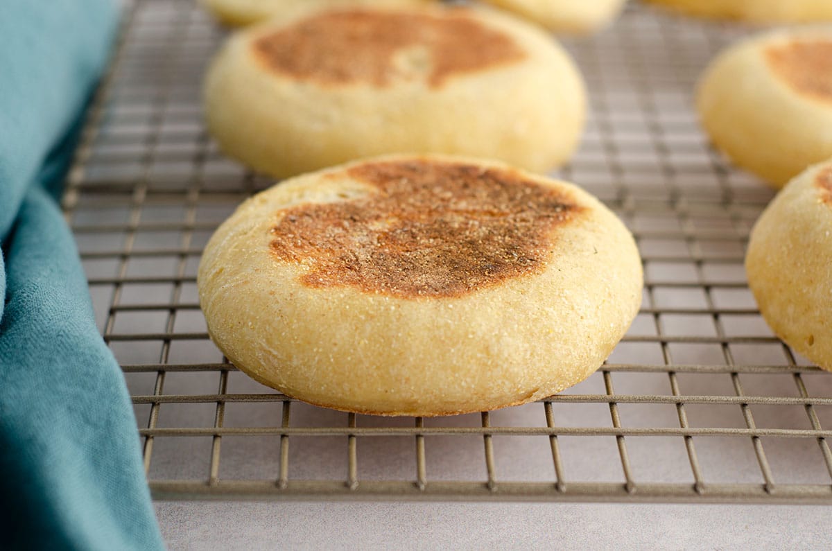 sourdough english muffin on a cooling rack