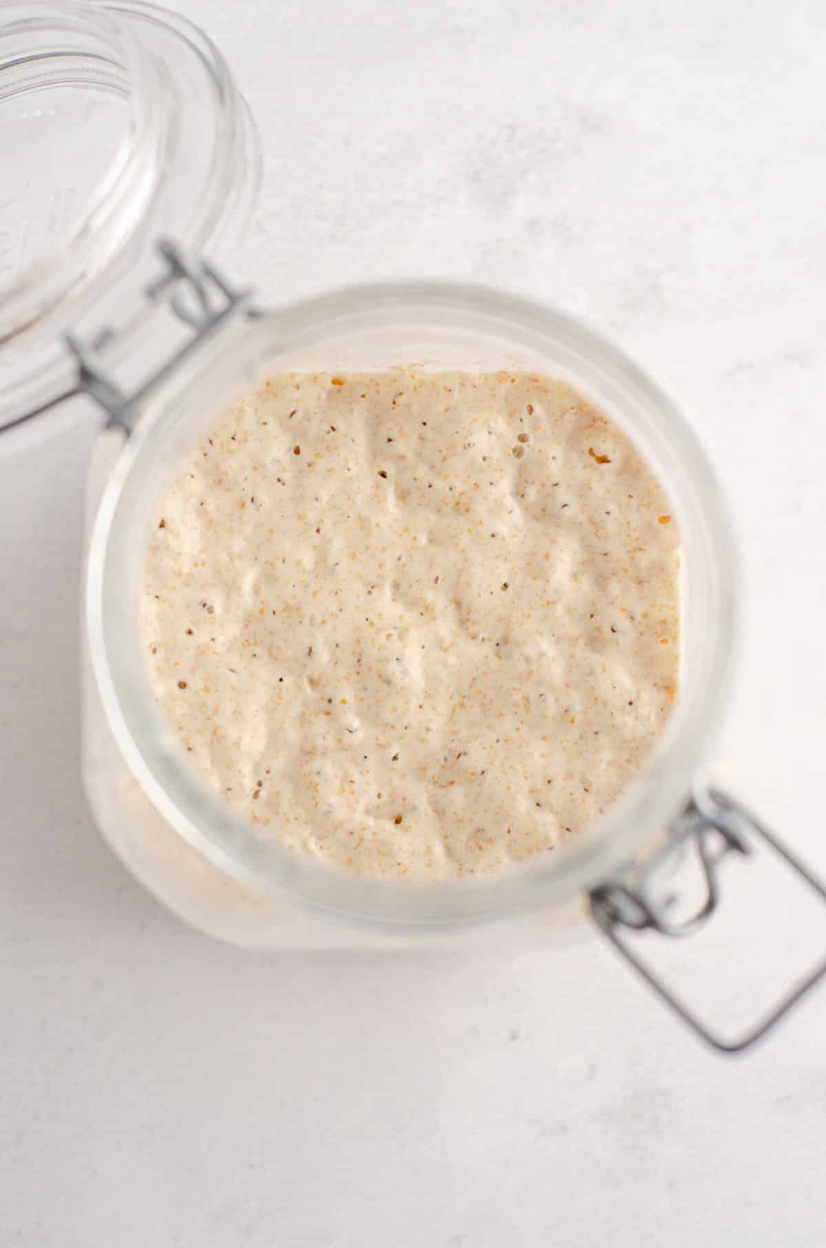 active sourdough starter in a glass jar