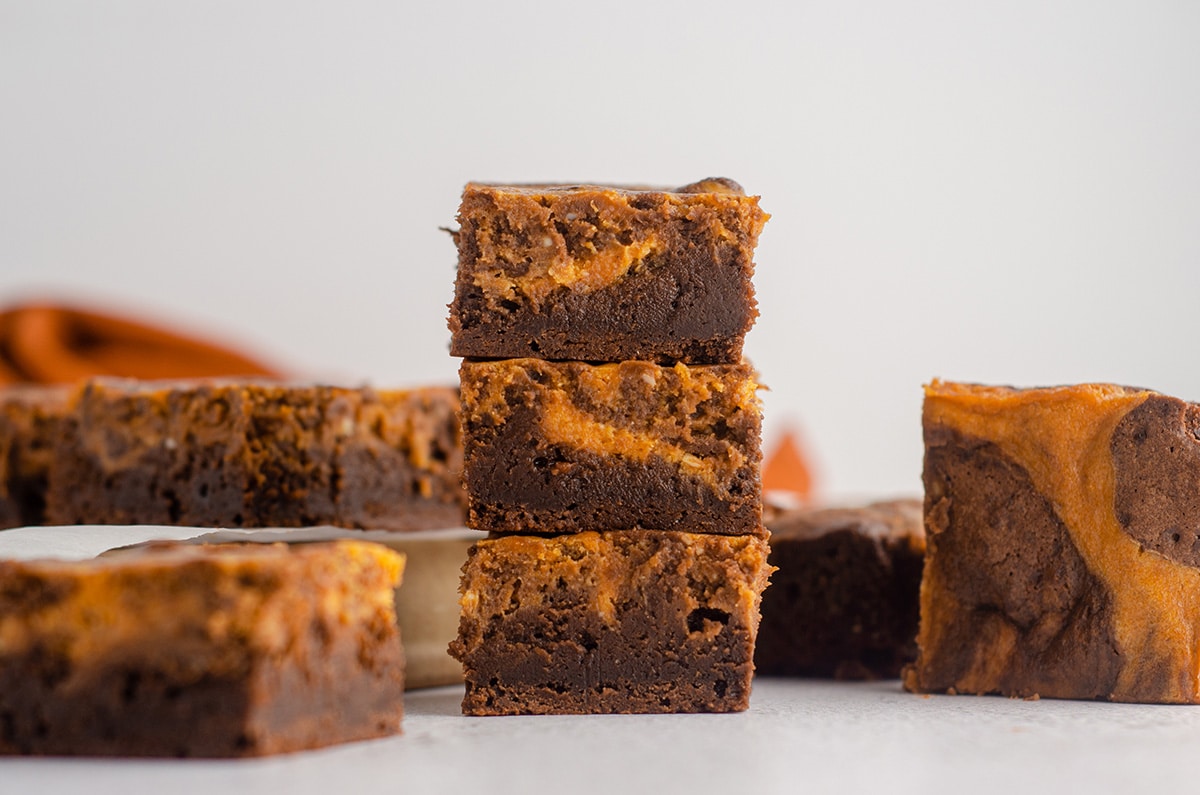 stack of pumpkin cheesecake brownies