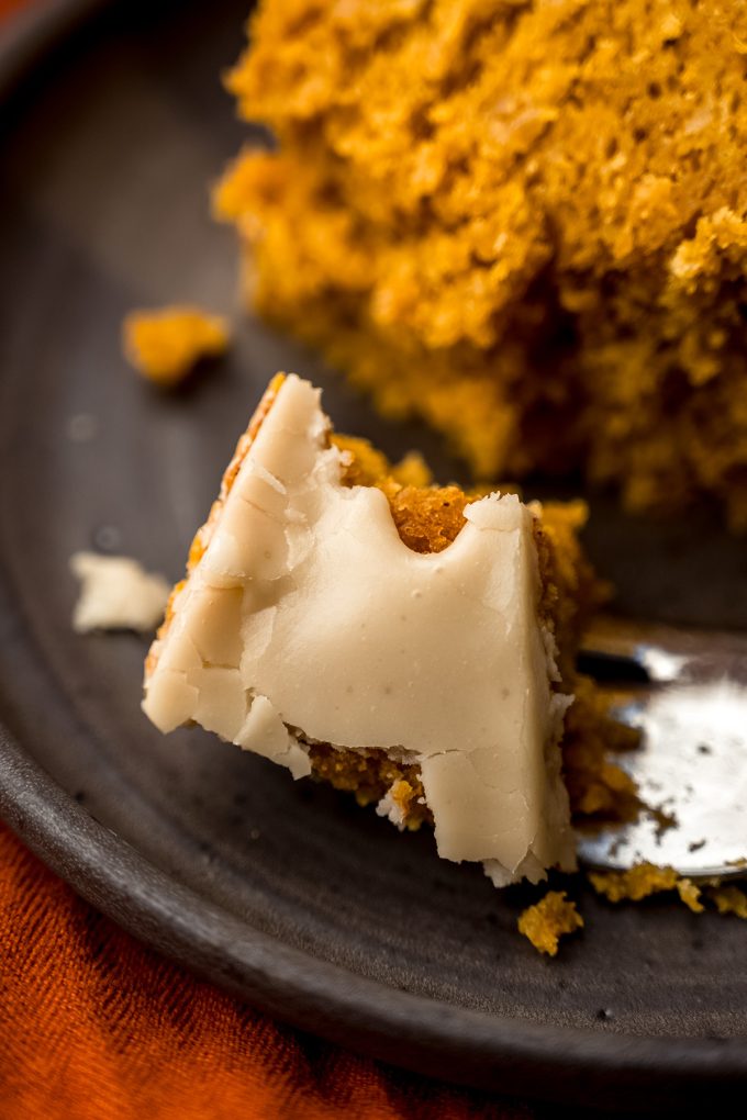 A closeup photo of a bite of pumpkin Bundt cake on a fork.