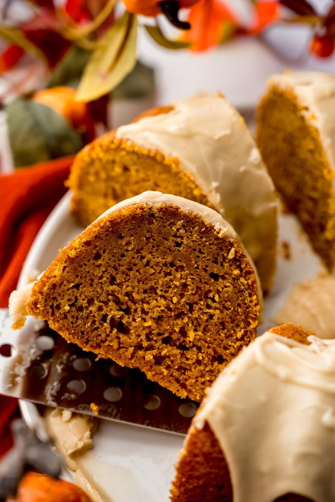 A slice of pumpkin Bundt cake on a platter.