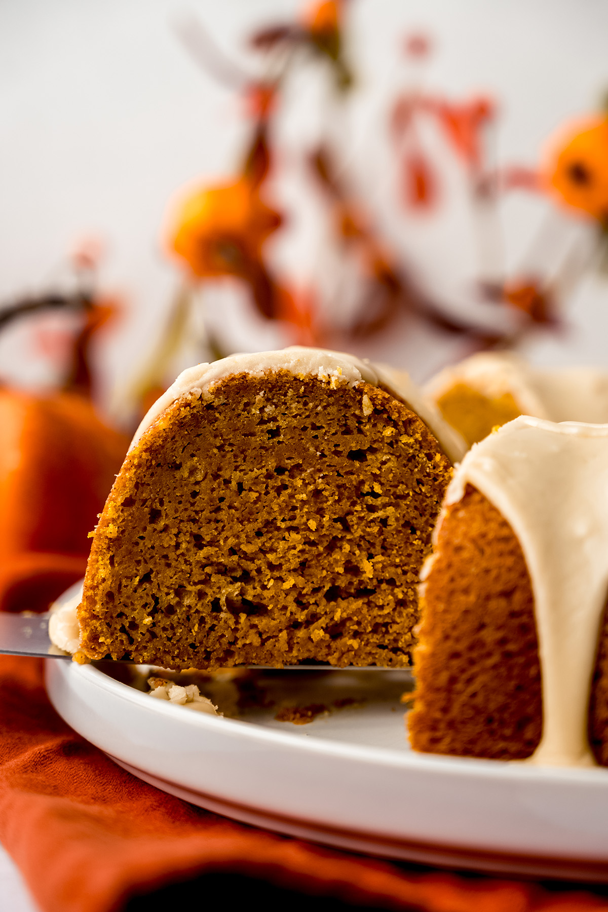 A slice of pumpkin Bundt cake on a platter.