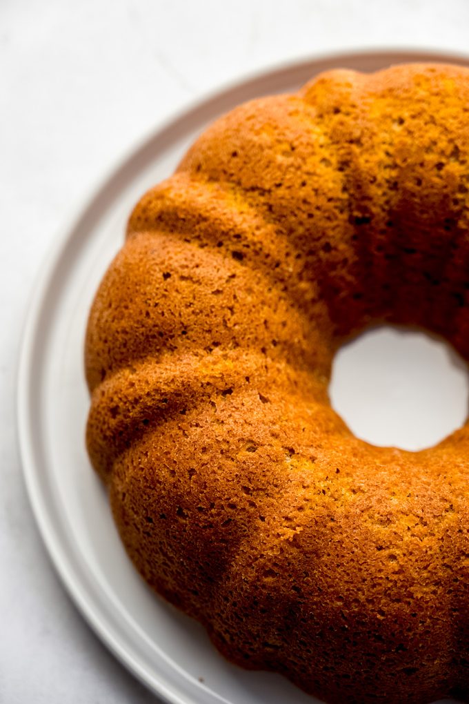 A pumpkin Bundt cake on a plate.