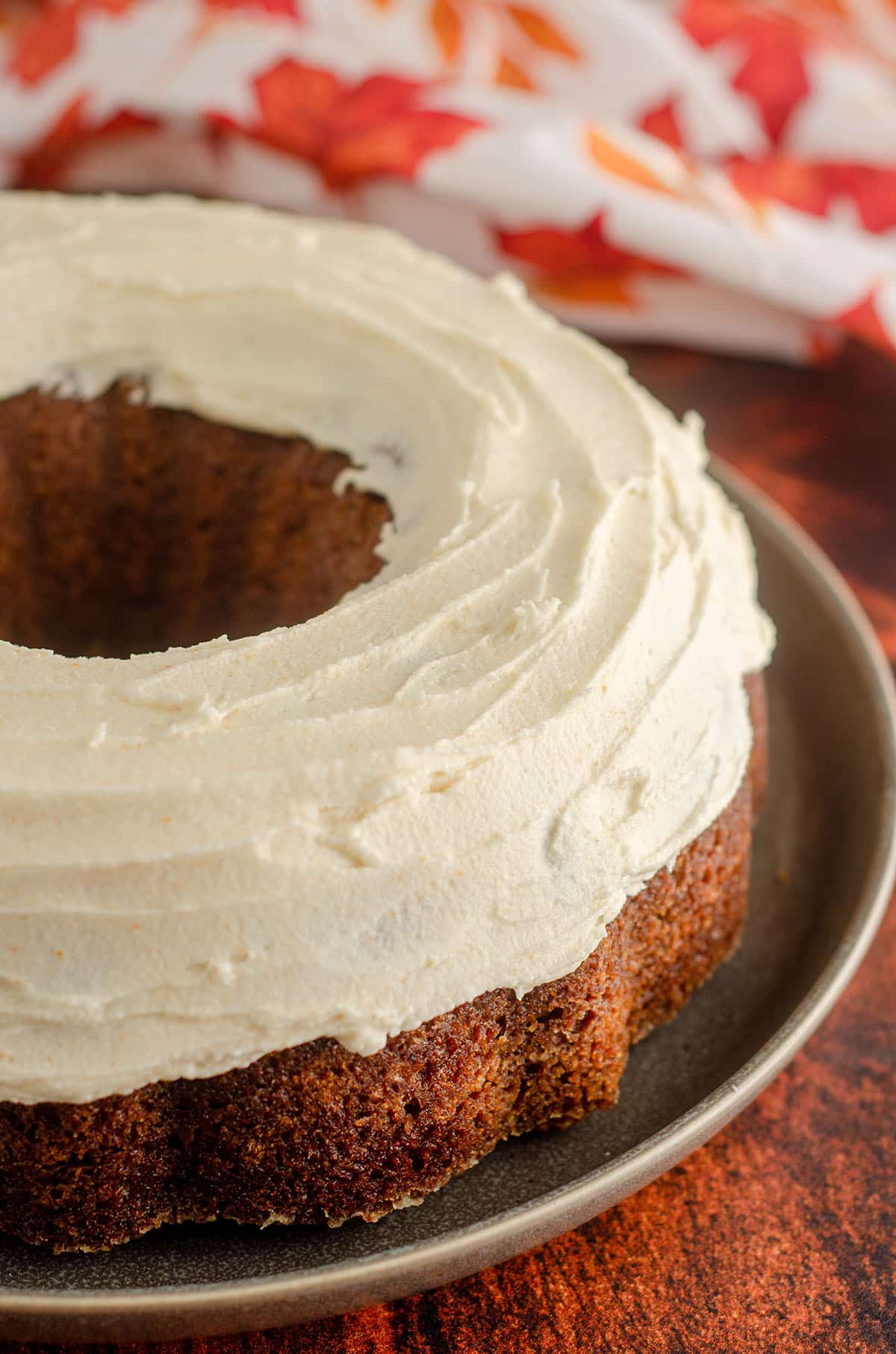 pumpkin bundt cake with brown butter buttercream on top