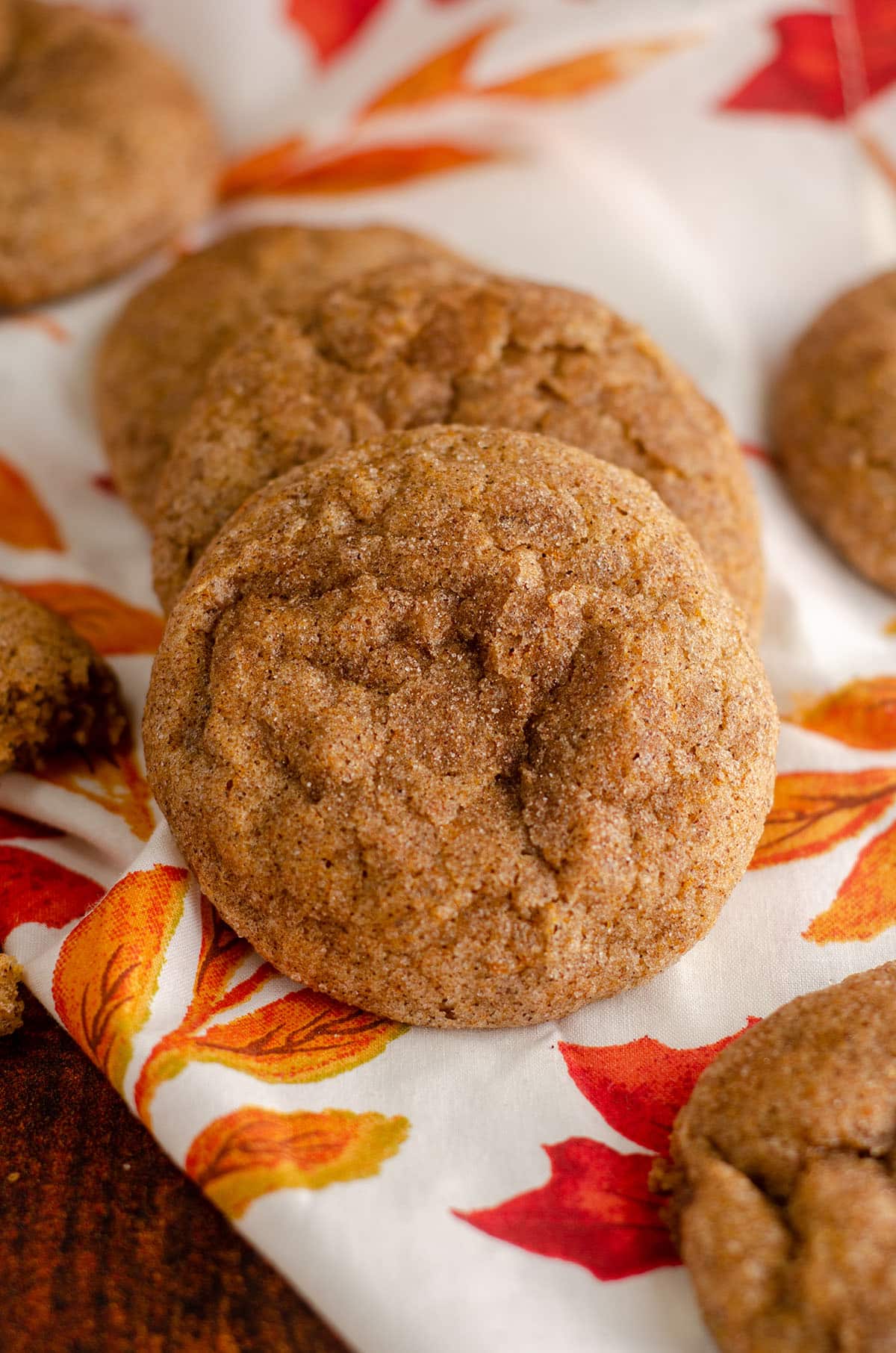 pumpkin spice cookies sitting on a fall leaves kitchen napkin
