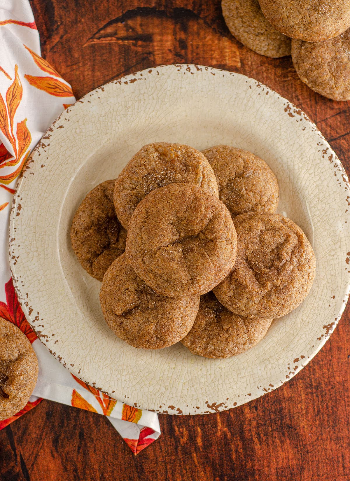 aerial photo of pumpkin spice cookies sitting on a cream colored plate