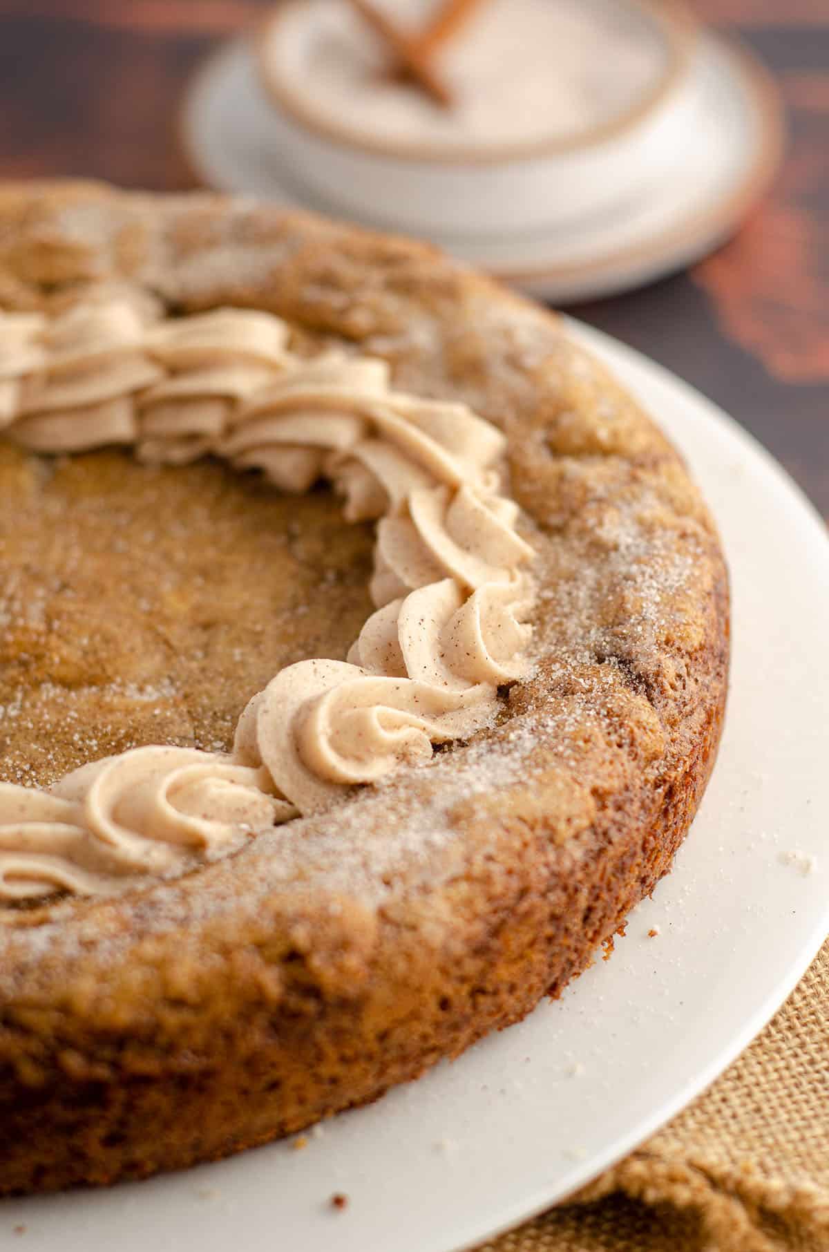 snickerdoodle cookie cake sitting on a plate