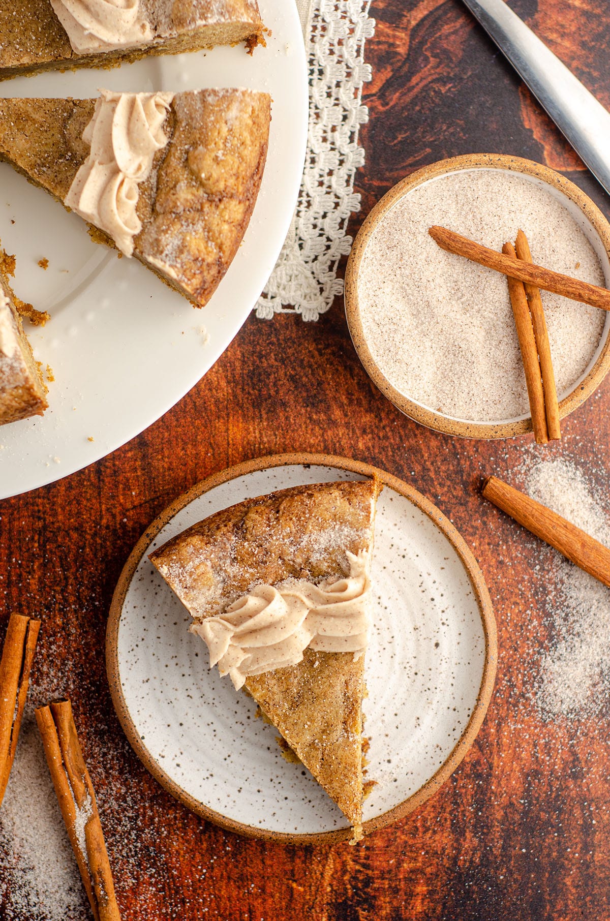 aerial photo of snickerdoodle cookie cake sitting on a ceramic plate